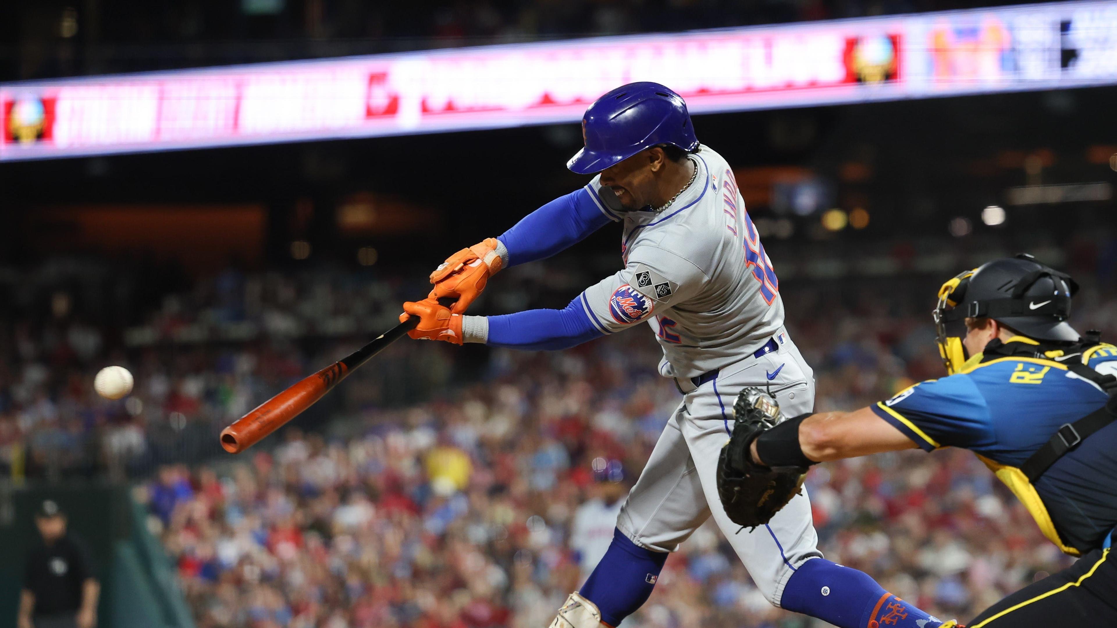 Sep 13, 2024; Philadelphia, Pennsylvania, USA; New York Mets shortstop Francisco Lindor (12) hits a single during the fifth inning against the Philadelphia Phillies at Citizens Bank Park. Mandatory Credit: Bill Streicher-Imagn Images / © Bill Streicher-Imagn Images