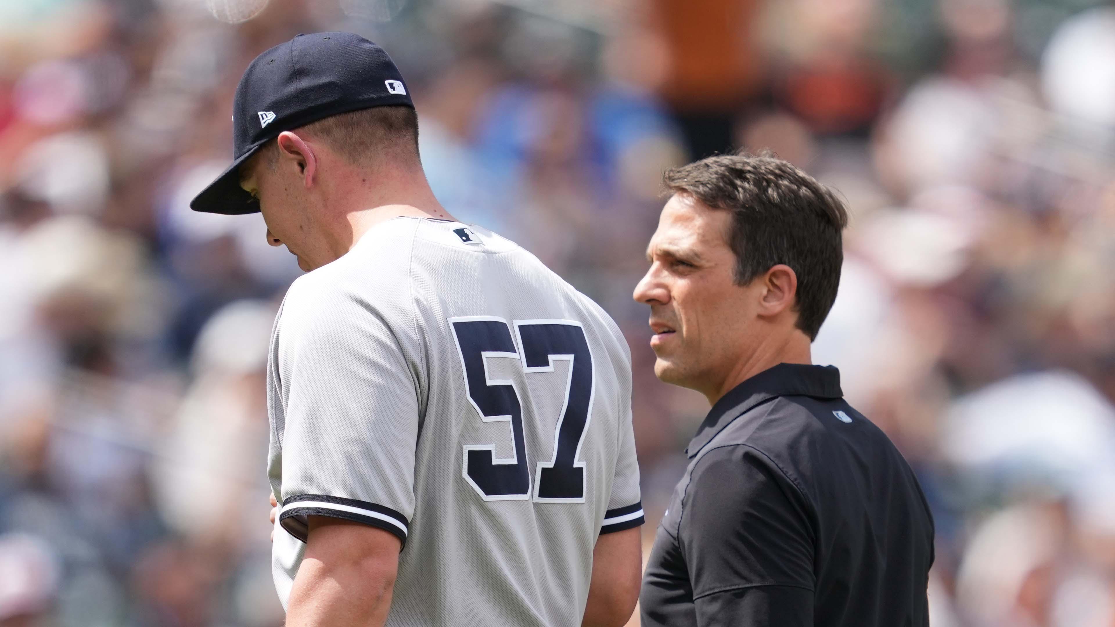 New York Yankees medical staff walks pitcher Chad Green (57) off the field in the sixth inning with an apparent injury against the Baltimore Orioles at Oriole Park at Camden Yards. / Mitch Stringer - USA TODAY Sports