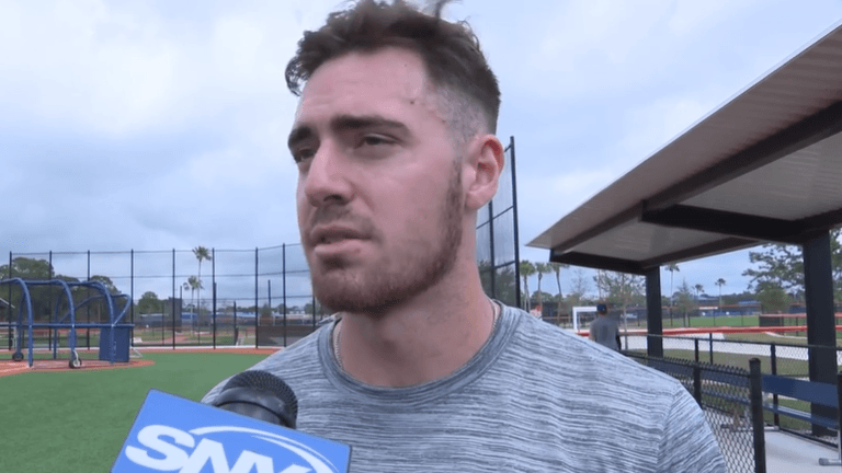 Matt Allan speaks to reporters in minor league camp.