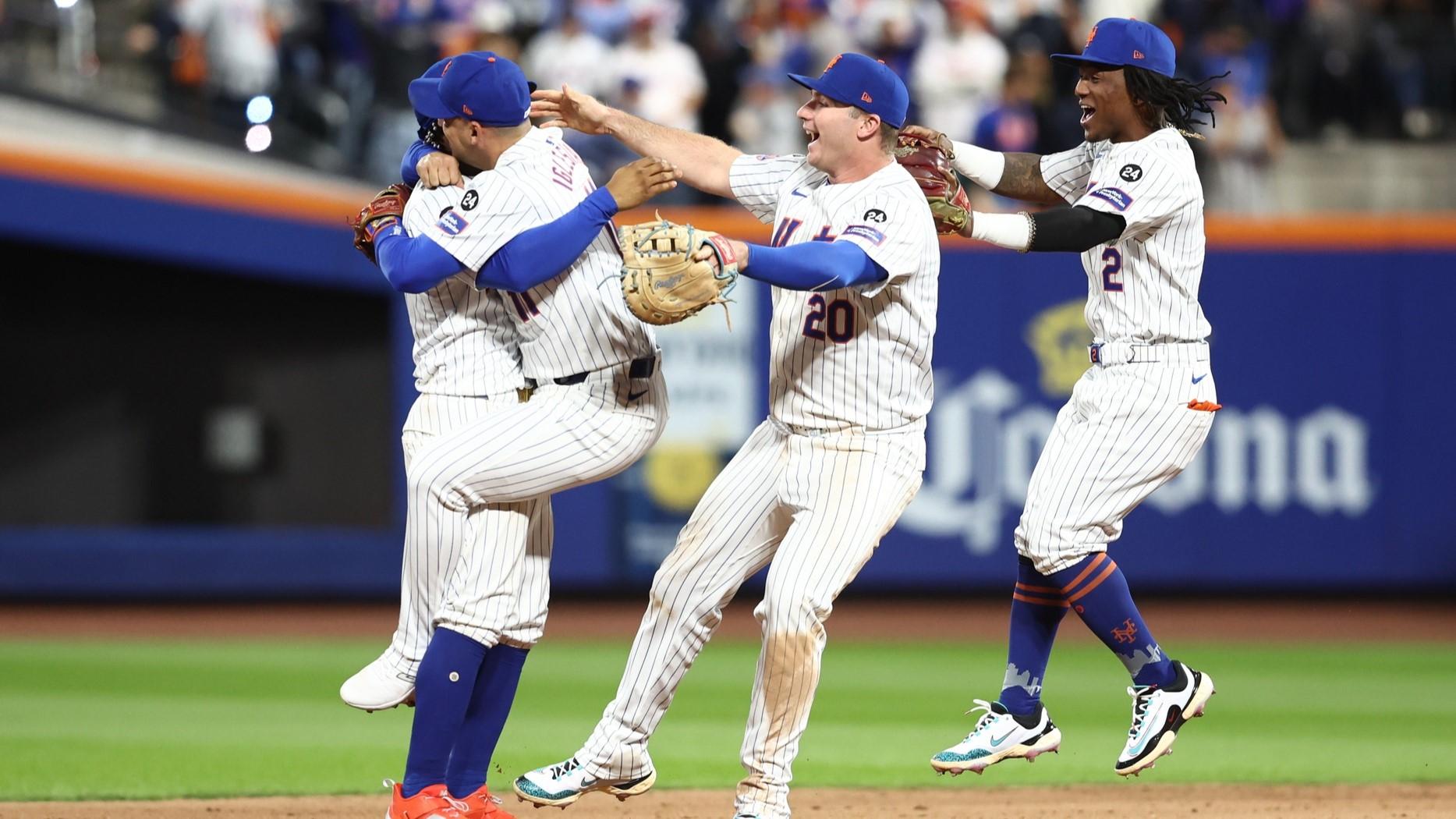 Oct 9, 2024; New York, New York, USA; New York Mets players including first baseman Pete Alonso (20), shortstop Luisangel Acuna (2), second baseman Jose Iglesias (11) and shortstop Francisco Lindor (12) celebrate defeating the Philadelphia Phillies in game four of the NLDS for the 2024 MLB Playoffs at Citi Field. 