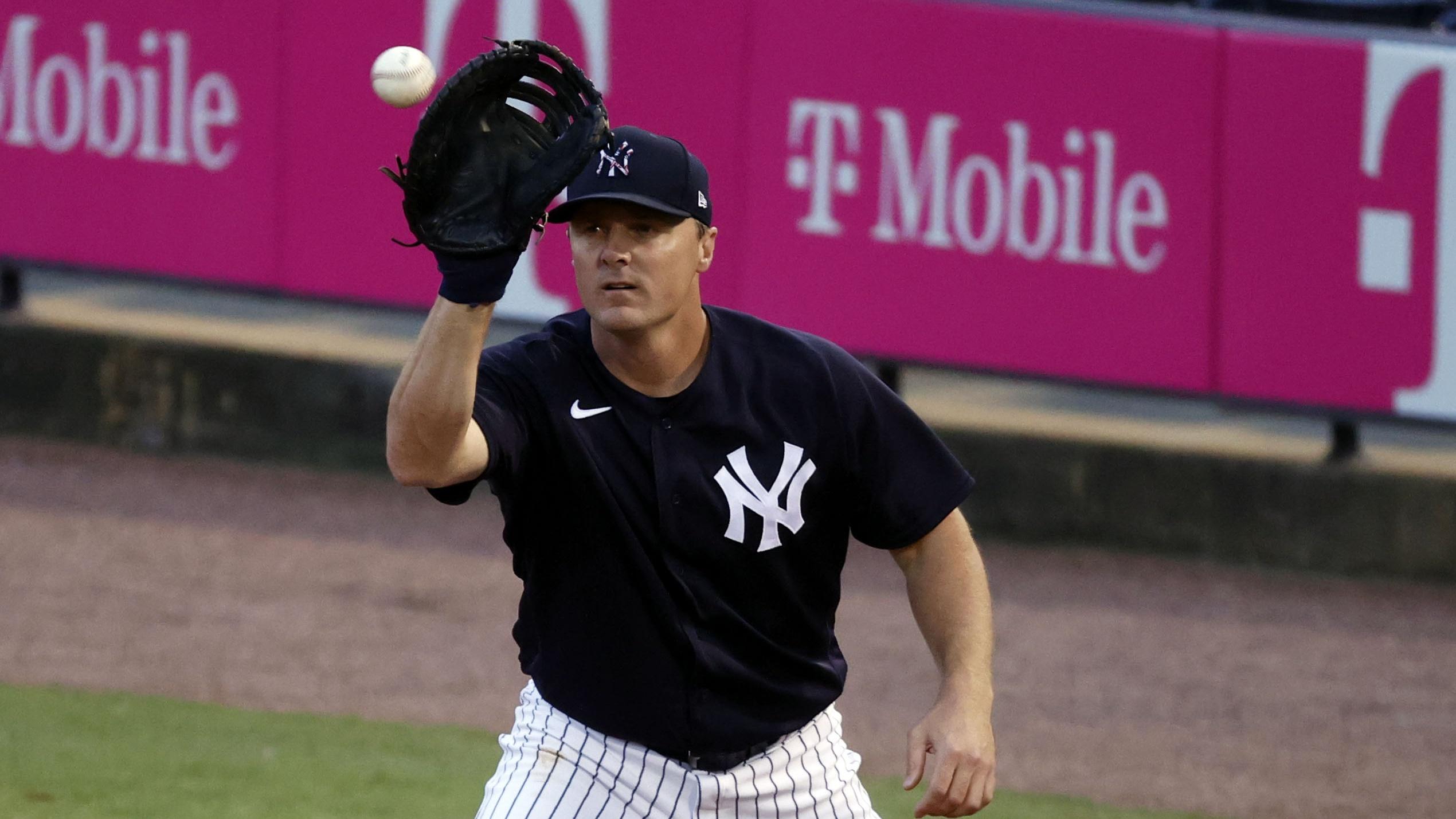 Mar 22, 2021; Tampa, Florida, USA; New York Yankees first baseman Jay Bruce (30) catches the ball for an out against the Philadelphia Phillies at George M. Steinbrenner Field. Mandatory Credit: Kim Klement-USA TODAY Sports