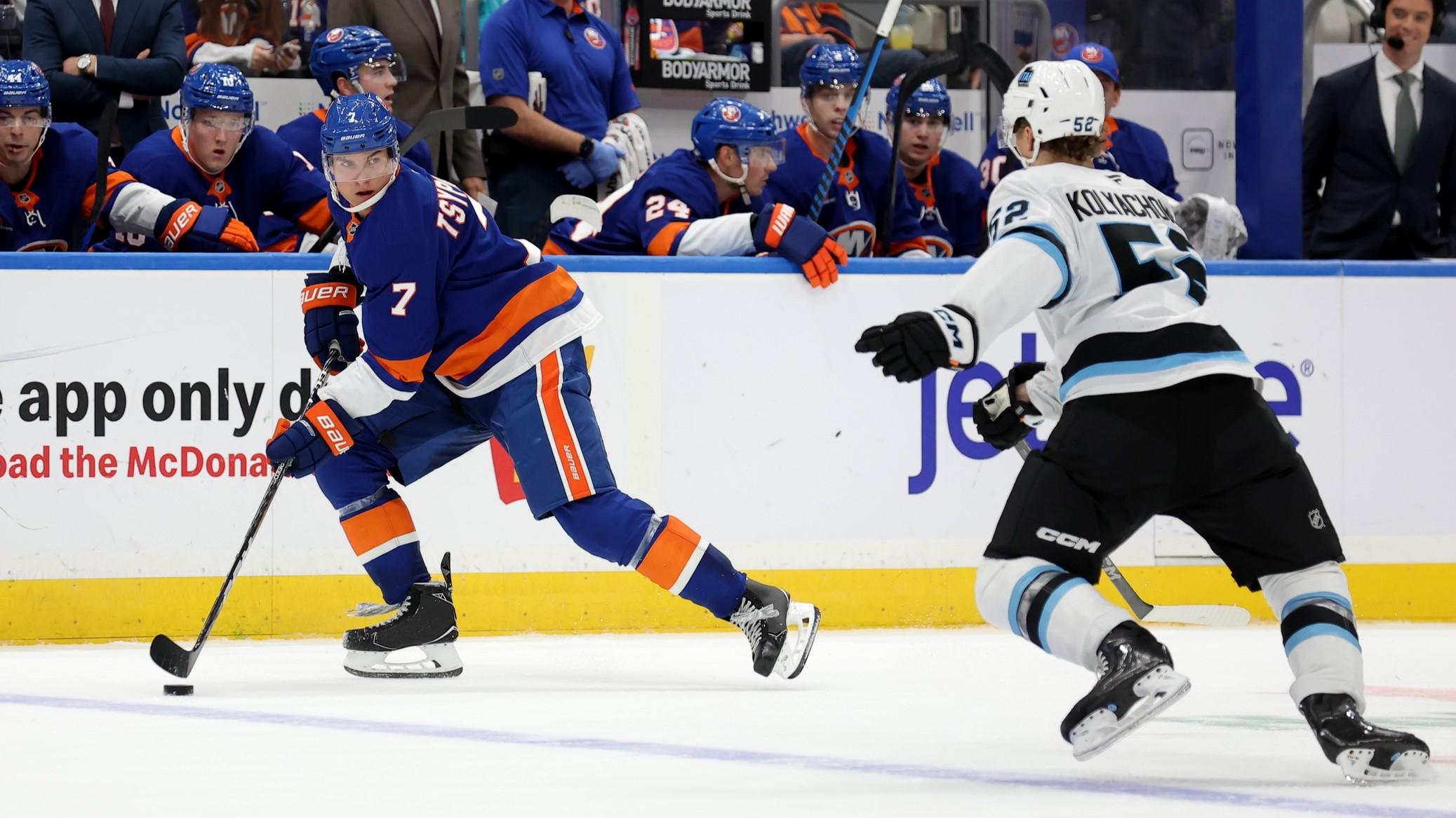 Oct 10, 2024; Elmont, New York, USA; New York Islanders right wing Maxim Tsyplakov (7) controls the puck against Utah Hockey Club defenseman Vladislav Kolyachonok (52) during the second period at UBS Arena.