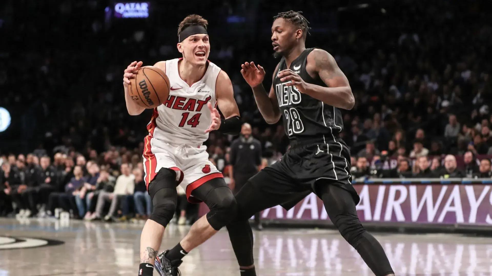 Jan 15, 2024; Brooklyn, New York, USA; Miami Heat guard Tyler Herro (14) looks to drive past Brooklyn Nets forward Dorian Finney-Smith (28) in the second quarter at Barclays Center. / Wendell Cruz-USA TODAY Sports