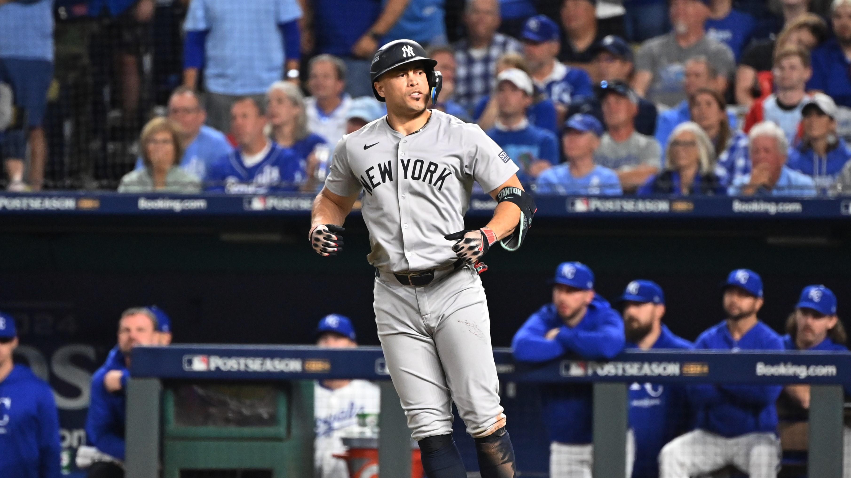 Oct 9, 2024; Kansas City, Missouri, USA; New York Yankees designated hitter Giancarlo Stanton (27) runs the bases after hiting a home run in the eighth inning against the Kansas City Royals during game three of the NLDS for the 2024 MLB Playoffs at Kauffman Stadium. Mandatory Credit: Peter Aiken-Imagn Images