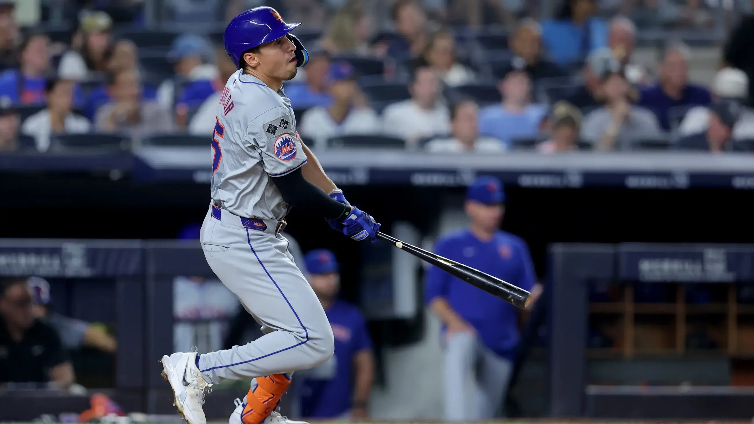 Jul 24, 2024; Bronx, New York, USA; New York Mets center fielder Tyrone Taylor (15) follows through on an RBI single against the New York Yankees during the sixth inning at Yankee Stadium. / Brad Penner-USA TODAY Sports