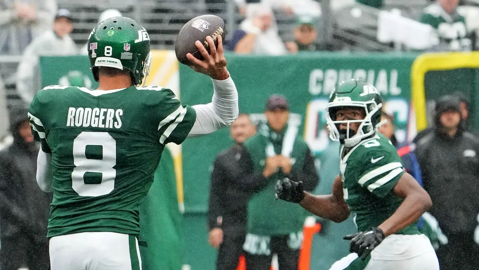 New York Jets quarterback Aaron Rodgers (8) throws complete pass to wide receiver Garrett Wilson (5) against the Denver Broncos in the second half at MetLife Stadium. / Robert Deutsch-Imagn Images