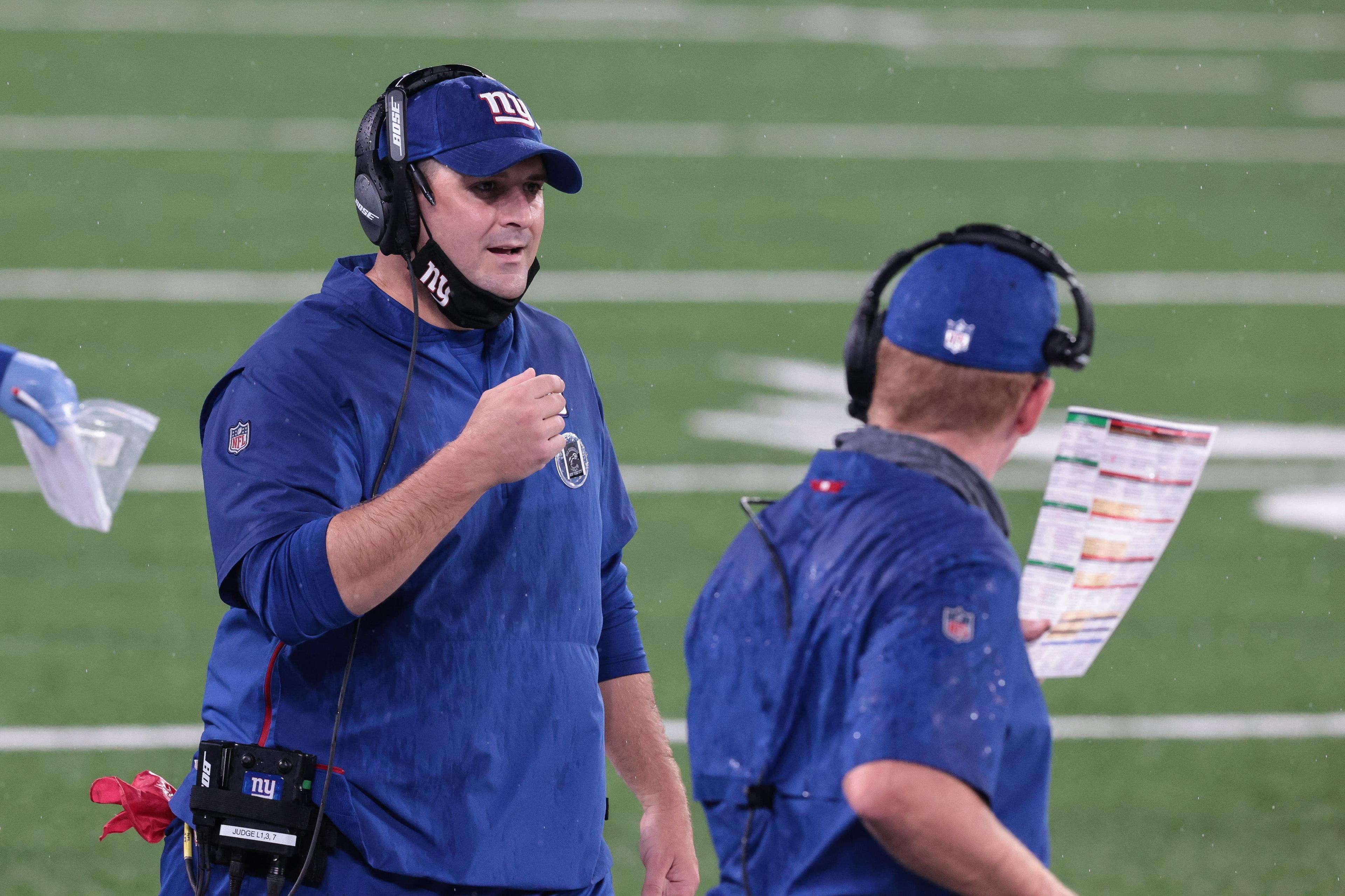 Aug 28, 2020; East Rutherford, New Jersey, USA; New York Giants head coach Joe Judge (left) talks with offensive coordinator Jason Garrett during the first half of the Blue-White Scrimmage at MetLife Stadium. Mandatory Credit: Vincent Carchietta-USA TODAY Sports / Vincent Carchietta-USA TODAY Sports