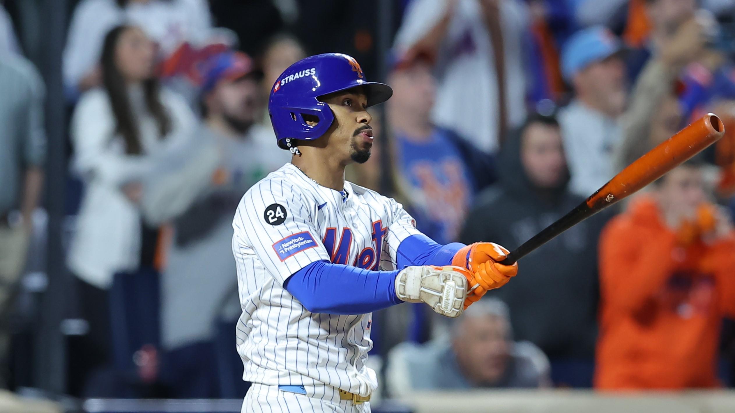 Oct 9, 2024; New York, New York, USA; New York Mets shortstop Francisco Lindor (12) hits a grand slam against the Philadelphia Phillies in the sixth inning in game four of the NLDS for the 2024 MLB Playoffs at Citi Field. 