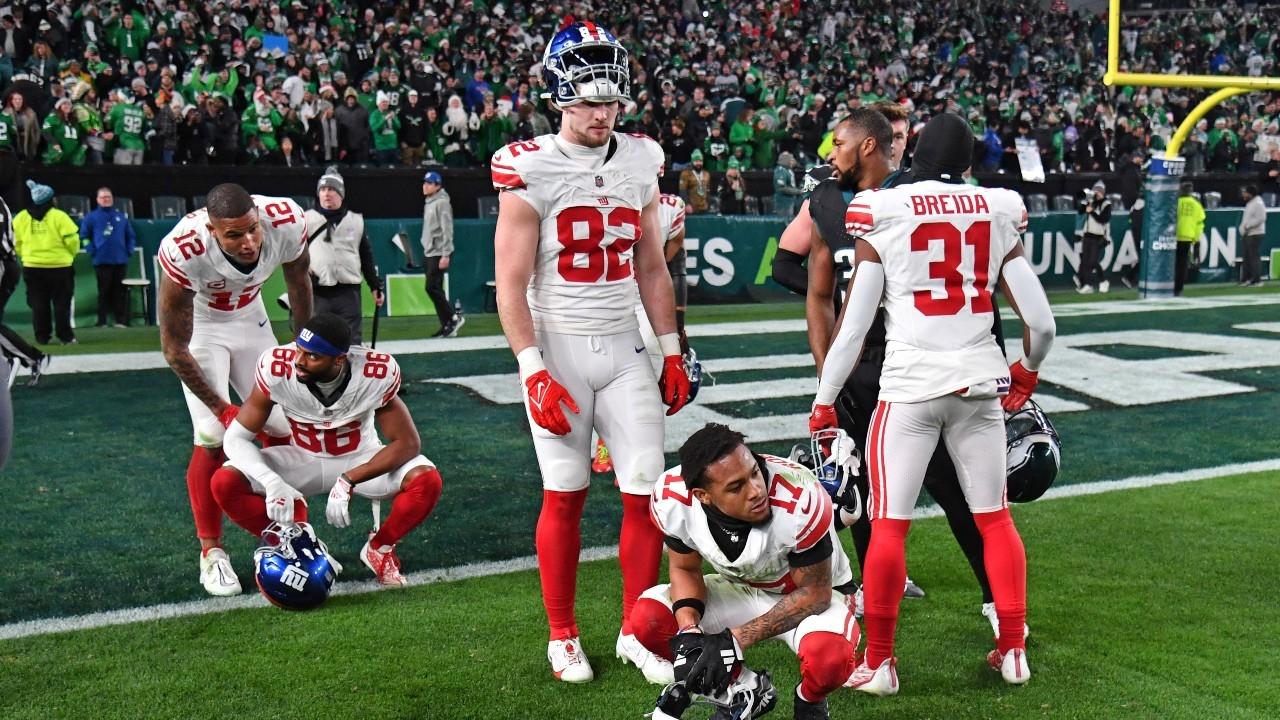 New York Giants players react after interception in end zone on final play of loss to the Philadelphia Eagles at Lincoln Financial Field.