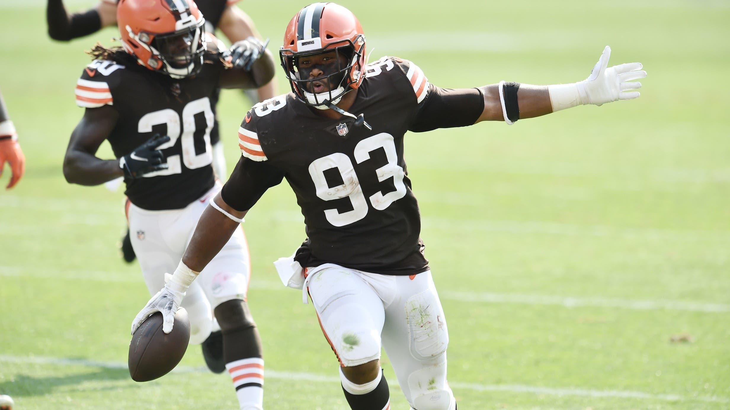 Sep 27, 2020; Cleveland, Ohio, USA; Cleveland Browns middle linebacker B.J. Goodson (93) and cornerback Tavierre Thomas (20) celebrate after Goodson intercepted a pass during the second half against the Washington Football Team at FirstEnergy Stadium / Ken Blaze-USA TODAY Sports