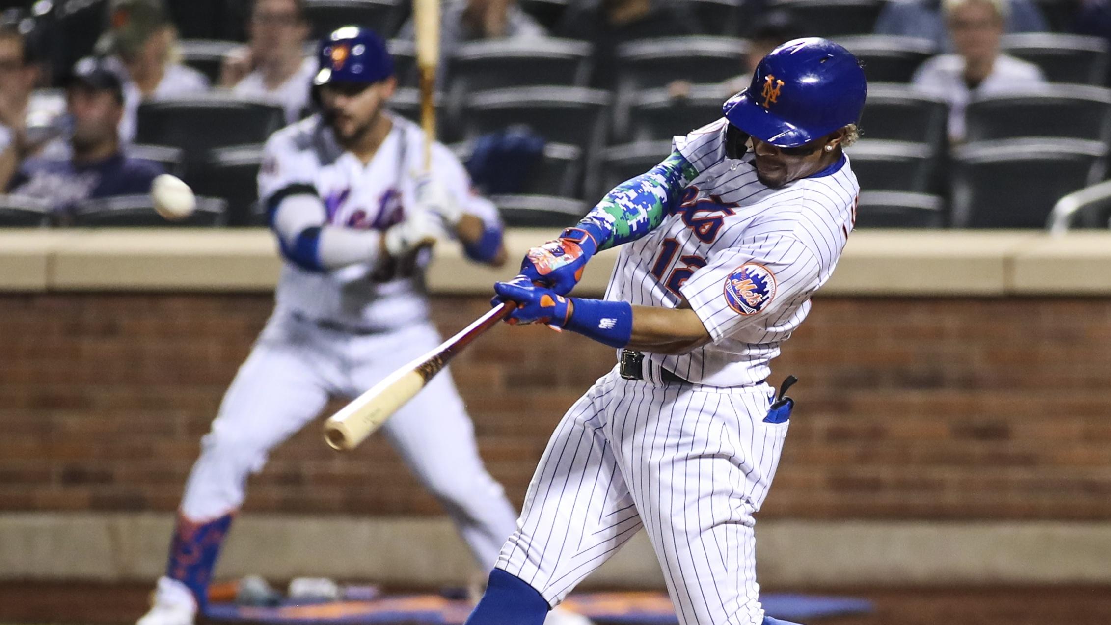 Sep 12, 2021; New York City, New York, USA; New York Mets shortstop Francisco Lindor (12) hits his third home run of the game in the eighth inning against the New York Yankees at Citi Field.