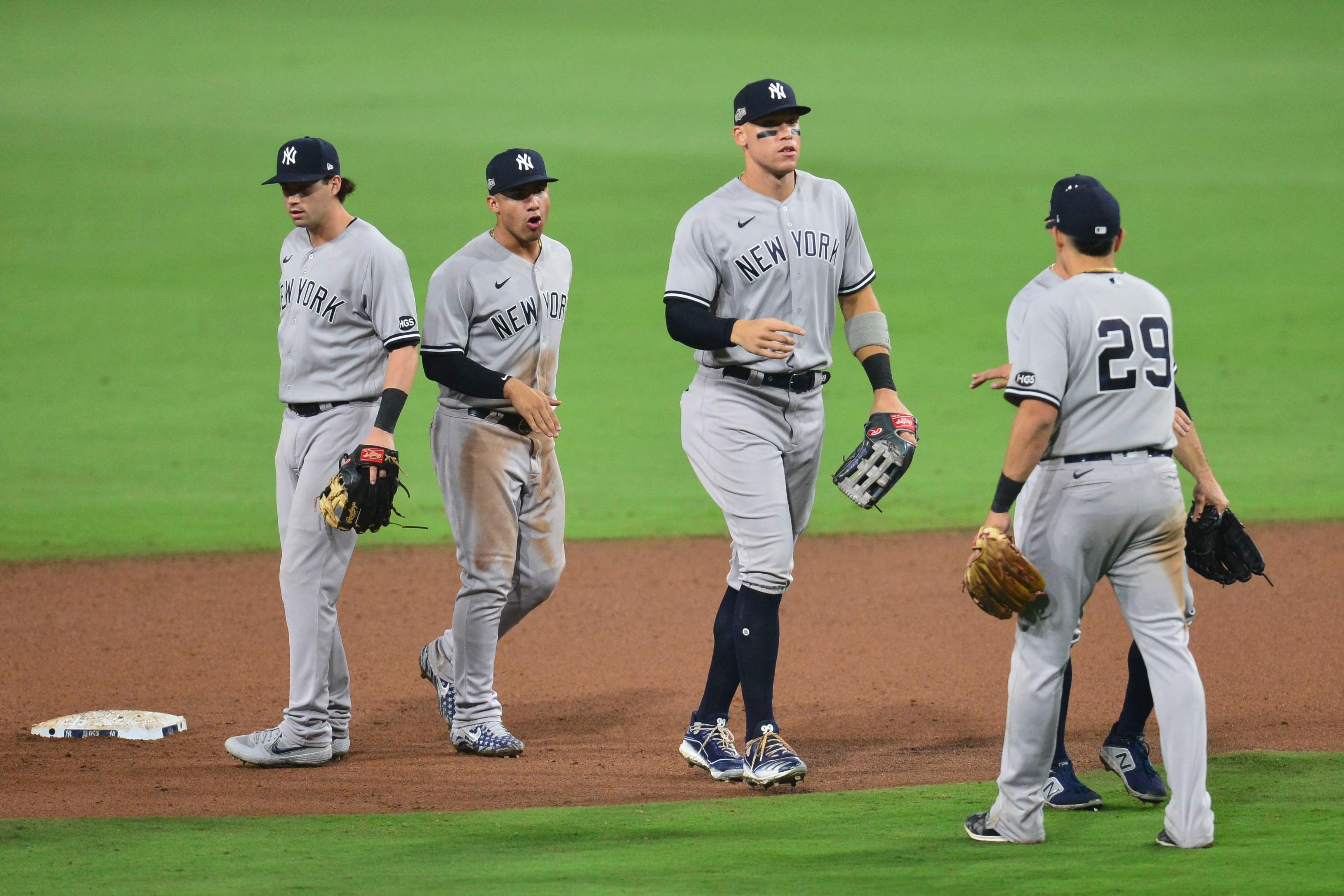 Oct 5, 2020; San Diego, California, USA; New York Yankees right fielder Aaron Judge (99) celebrates with teammates after game one of the 2020 ALDS against the Tampa Bay Rays at Petco Park. Mandatory Credit: Gary A. Vasquez-USA TODAY Sports