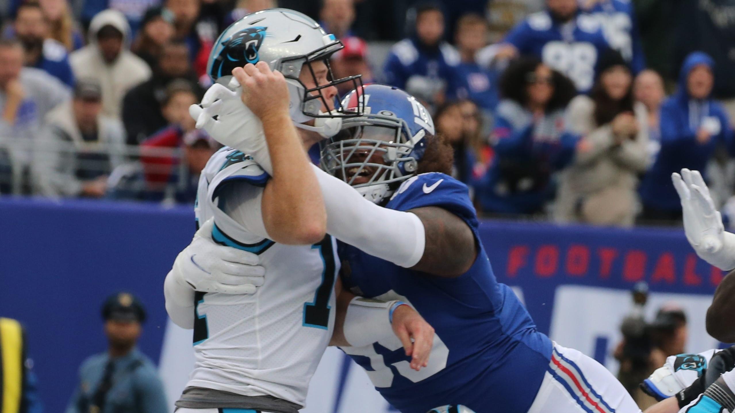 Carolina quarterback Sam Darnold was called for intentional grounding and the Giants were awarded a safety as Darnold was rushed by Leonard Williams of the Giants in the first half as the Carolina Panthers faced the New York Giants at MetLife Stadium in East Rutherford, NJ on October 24, 2021. The Carolina Panthers Faced The New York Giants At Metlife Stadium In East Rutherford Nj On October 24 2021