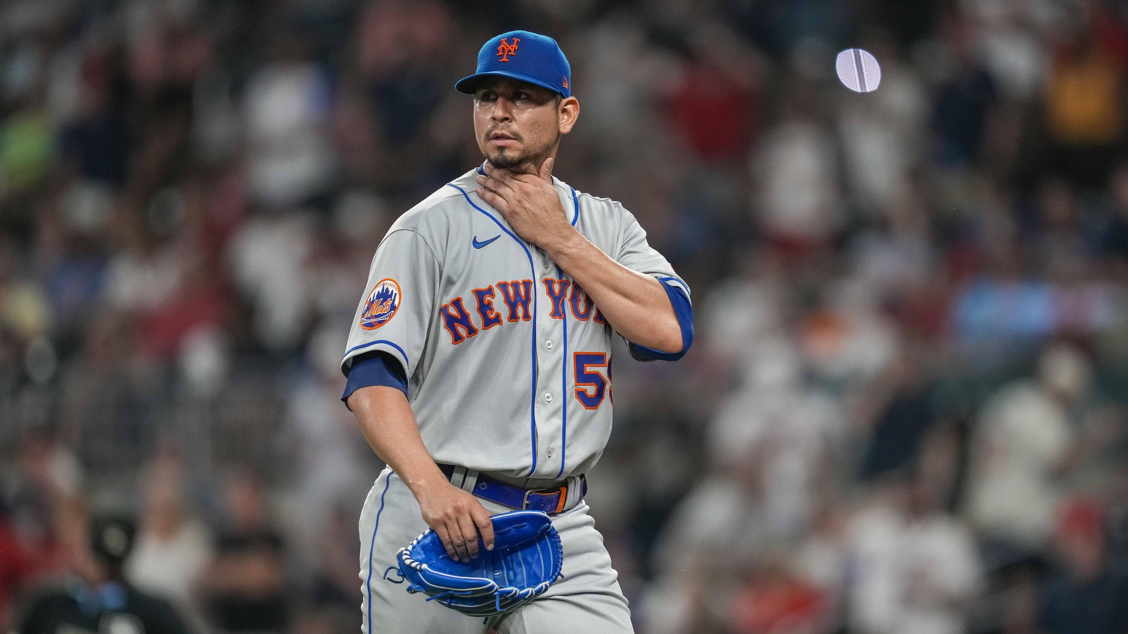 Jun 6, 2023; Cumberland, Georgia, USA; New York Mets starting pitcher Carlos Carrasco (59) leaves the field after being removed from the game against the Atlanta Braves during the sixth inning at Truist Park.