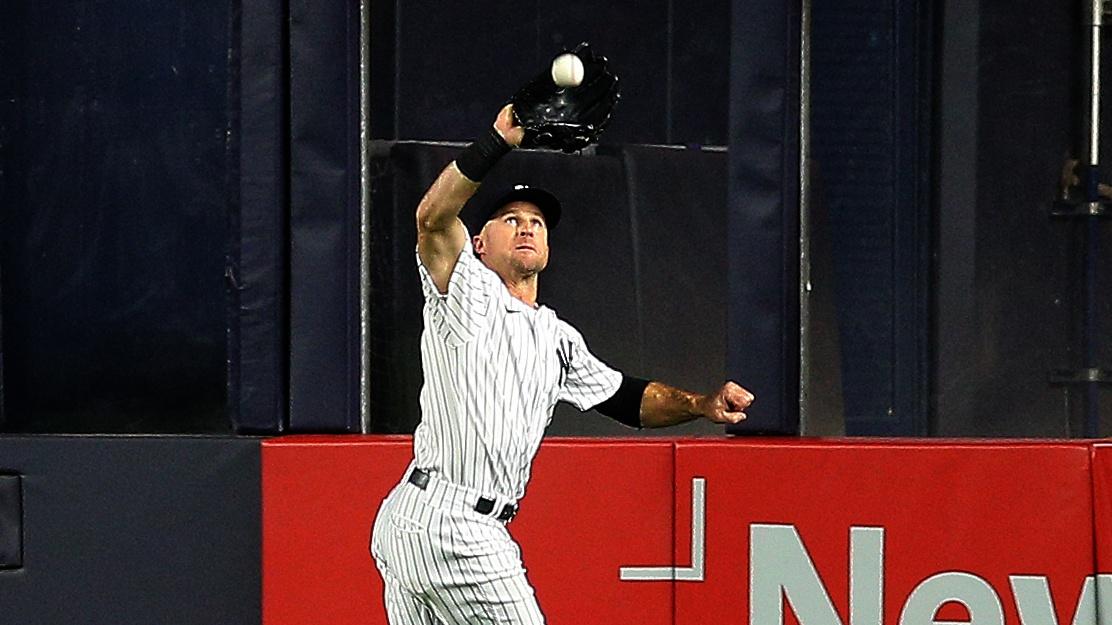 Oct 1, 2021; Bronx, New York, USA; New York Yankees center fielder Brett Gardner (11) makes a running catch against the Tampa Bay Rays during the ninth inning at Yankee Stadium. Mandatory Credit: Andy Marlin-USA TODAY Sports