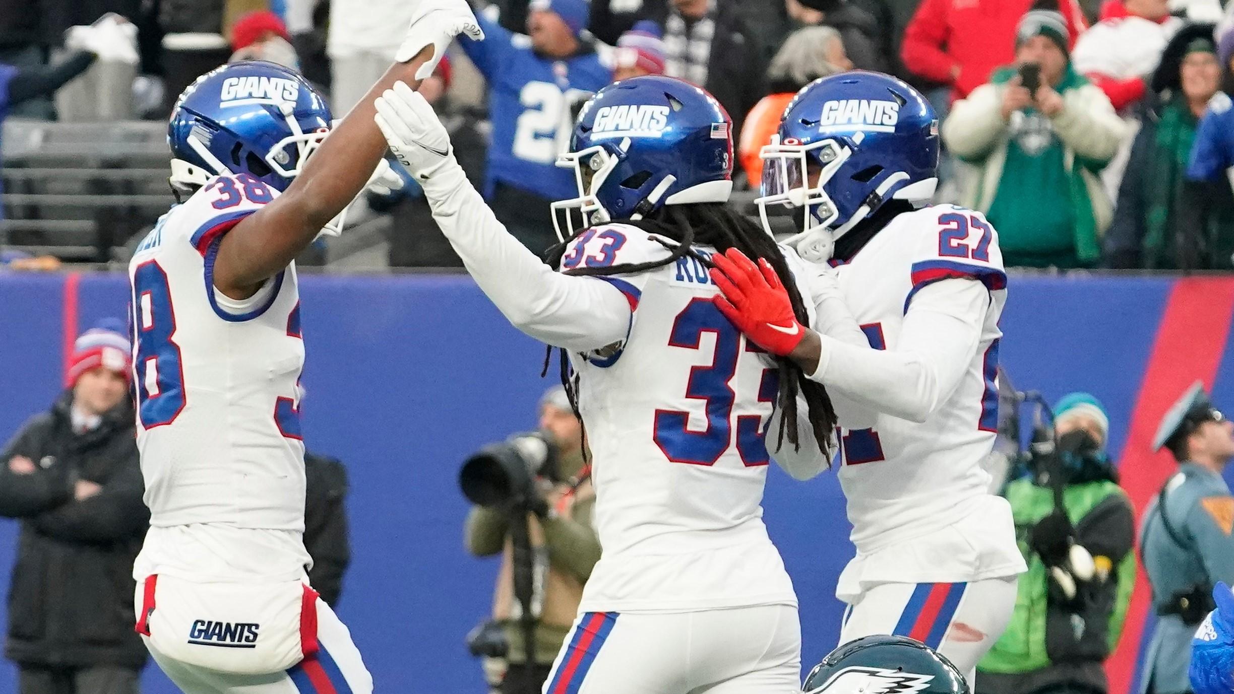 Nov 28, 2021; East Rutherford, NJ, USA; Philadelphia Eagles wide receiver Jalen Reagor (18) reacts after dropping a potential game winning touchdown with seconds left in the game, as members of the New York Giants celebrate at MetLife Stadium. Mandatory Credit: Robert Deutsch-USA TODAY Sports