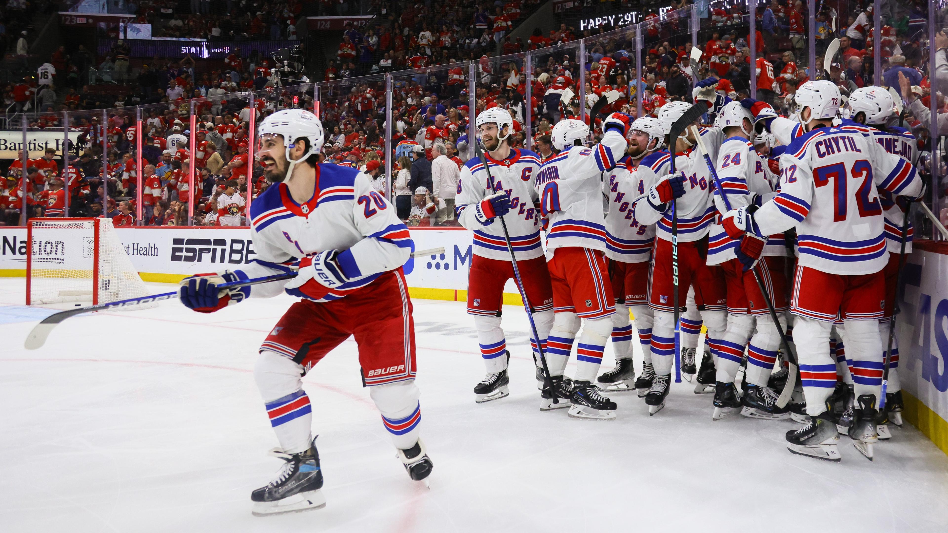 May 26, 2024; Sunrise, Florida, USA; New York Rangers celebrate an overtime goal by New York Rangers center Alex Wennberg (91) to defeat the Florida Panthers in game three of the Eastern Conference Final of the 2024 Stanley Cup Playoffs at Amerant Bank Arena. Mandatory Credit: Sam Navarro-USA TODAY Sports