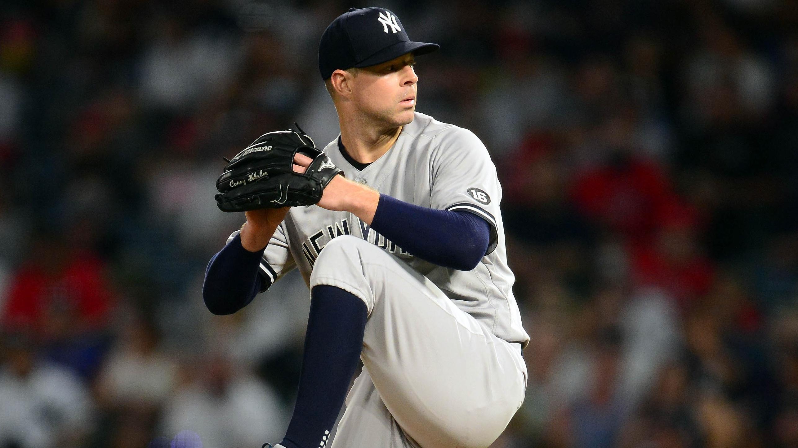 Aug 30, 2021; Anaheim, California, USA; New York Yankees starting pitcher Corey Kluber (28) throws against the Los Angeles Angels during the fourth inning at Angel Stadium.