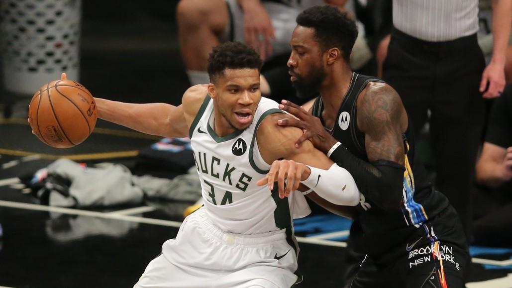 Jun 15, 2021; Brooklyn, New York, USA; Milwaukee Bucks power forward Giannis Antetokounmpo (34) controls the ball against Brooklyn Nets power forward Jeff Green (8) during the fourth quarter of game five of the second round of the 2021 NBA Playoffs at Barclays Center.