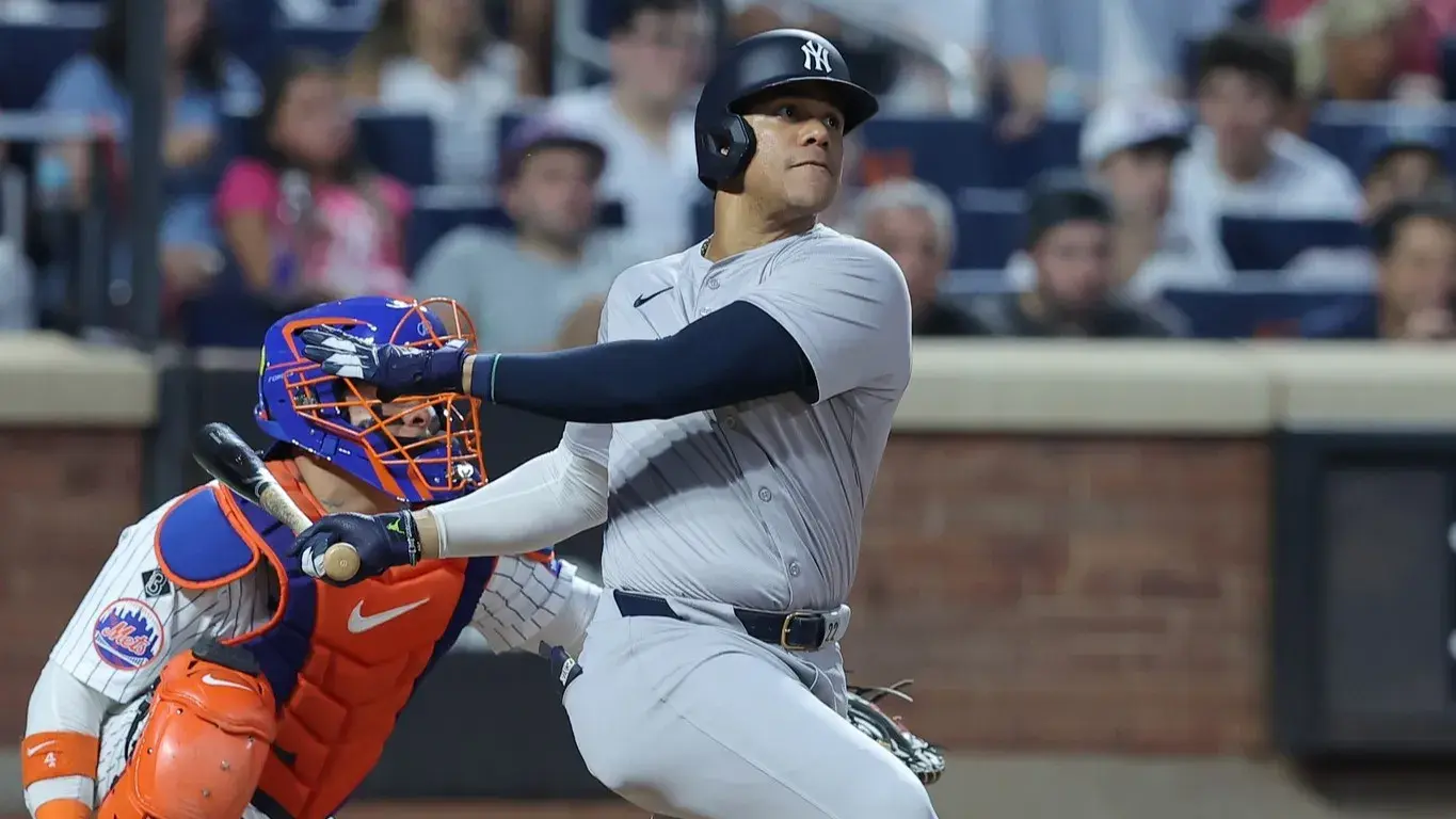 Jun 25, 2024; New York City, New York, USA; New York Yankees right fielder Juan Soto (22) follows through on a solo home run against the New York Mets during the fifth inning at Citi Field. / Brad Penner-USA TODAY Sports