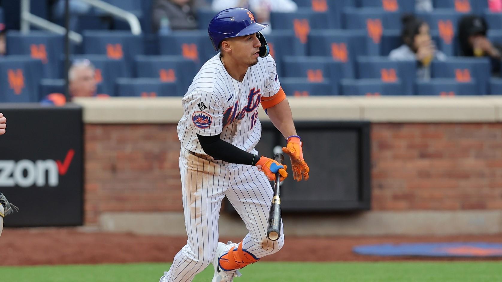 Apr 17, 2024; New York City, New York, USA; New York Mets right fielder Tyrone Taylor (15) follows through on a two run single against the Pittsburgh Pirates during the sixth inning at Citi Field. 