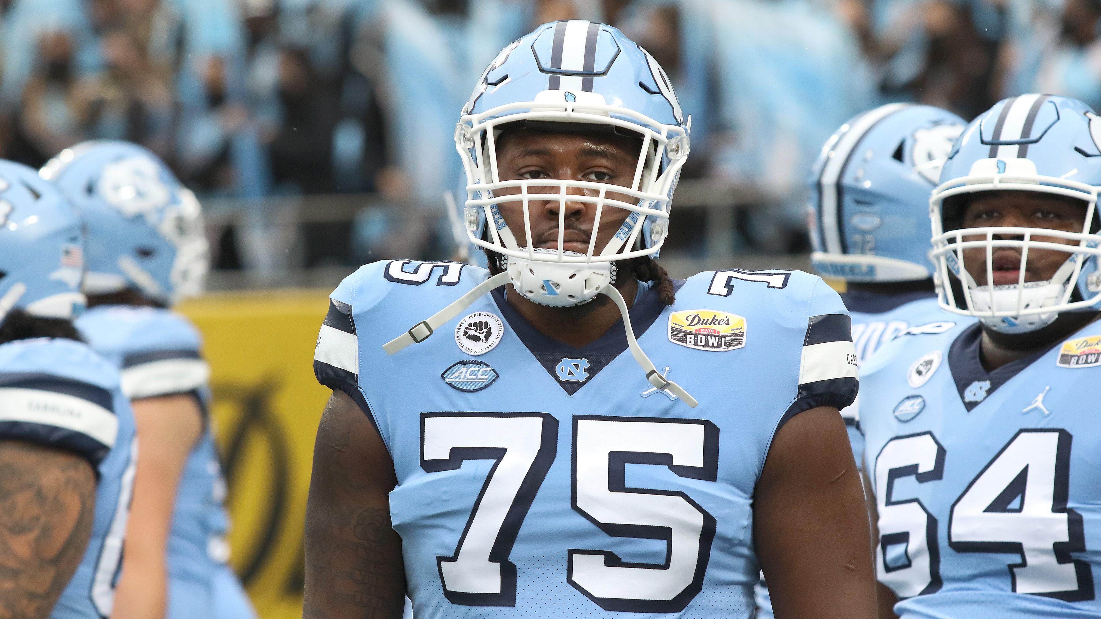 CHARLOTTE, NC - DECEMBER 30: Joshua Ezeudu (75) offensive lineman of North Carolina during the Duke's Mayo Bowl college football game between the North Carolina Tar Heels and the South Carolina Gamecocks on December 30, 2021 at Bank of America Stadium in Charlotte, N.C.