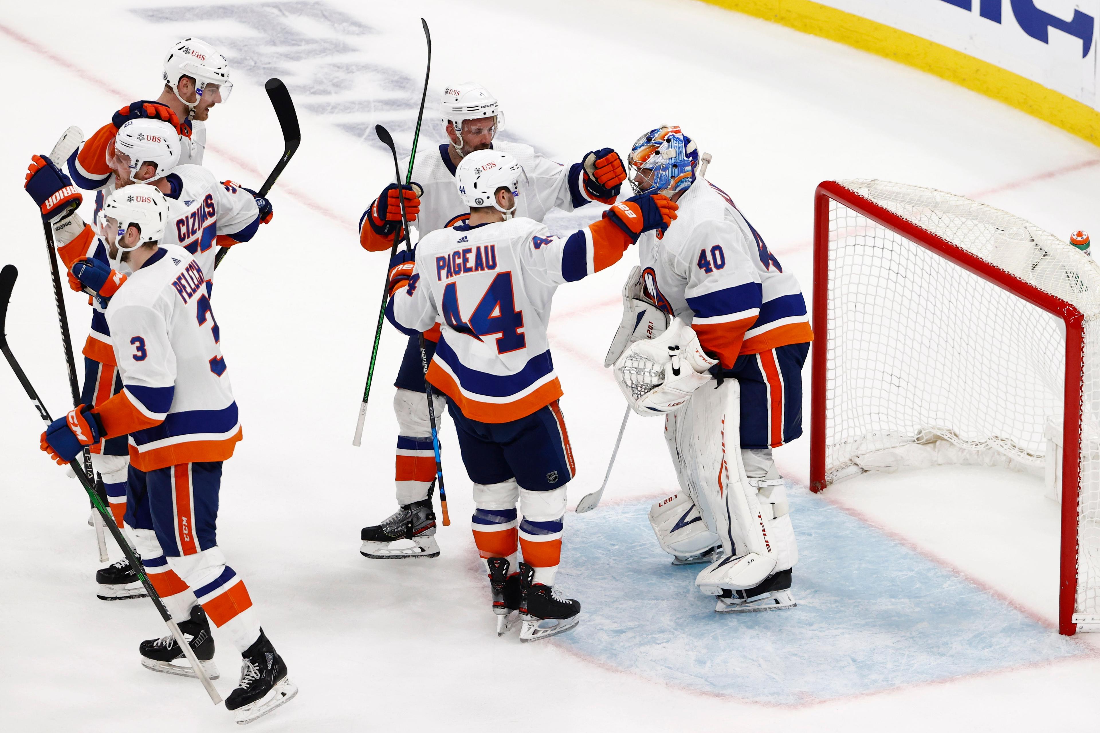 Jun 7, 2021; Boston, Massachusetts, USA; New York Islanders center Jean-Gabriel Pageau (44) goes to congratulate goaltender Semyon Varlamov (40) after their 5-4 win over the Boston Bruins in game five of the second round of the 2021 Stanley Cup Playoffs at TD Garden. Mandatory Credit: Winslow Townson-USA TODAY Sports