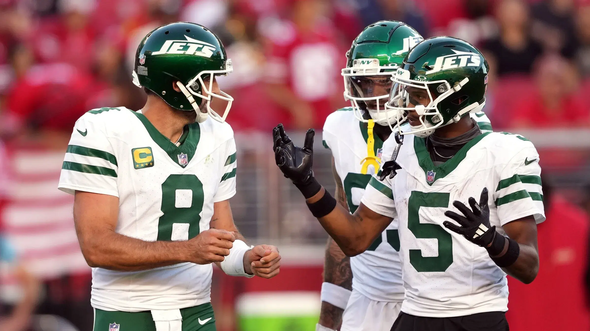 New York Jets quarterback Aaron Rodgers (8) and wide receiver Garrett Wilson (5) talk on the field during the second quarter against the San Francisco 49ers at Levi's Stadium. / Darren Yamashita-Imagn Images