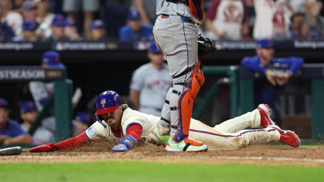 Oct 6, 2024; Philadelphia, Pennsylvania, USA; Philadelphia Phillies second baseman Bryson Stott (5) scores a run in the eighth inning against the Mets during Game 2 of the 2024 NLDS at Citizens Bank Park.