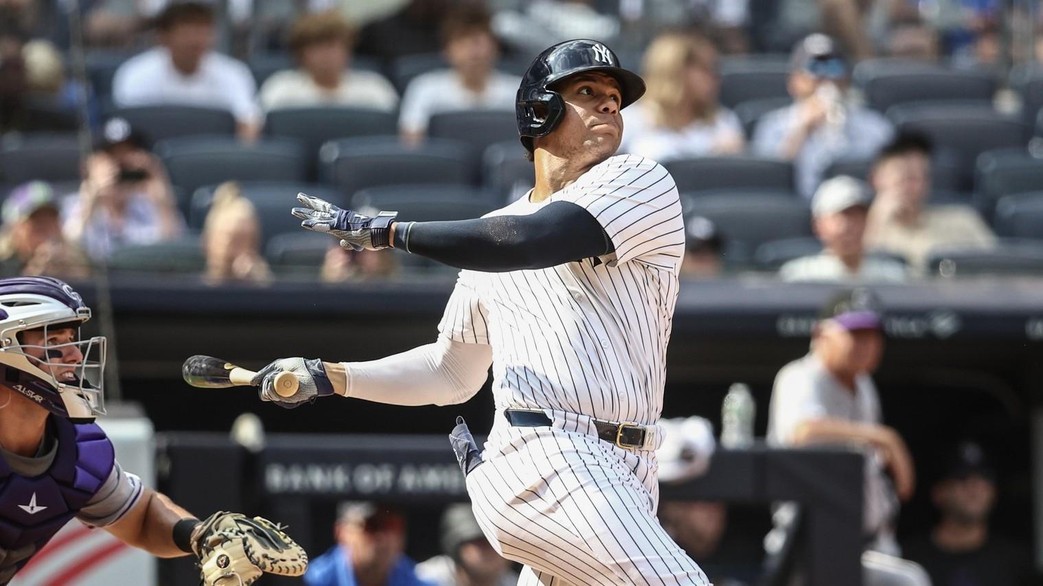 New York Yankees right fielder Juan Soto (22) hits a solo home run in the seventh inning against the Colorado Rockies at Yankee Stadium.