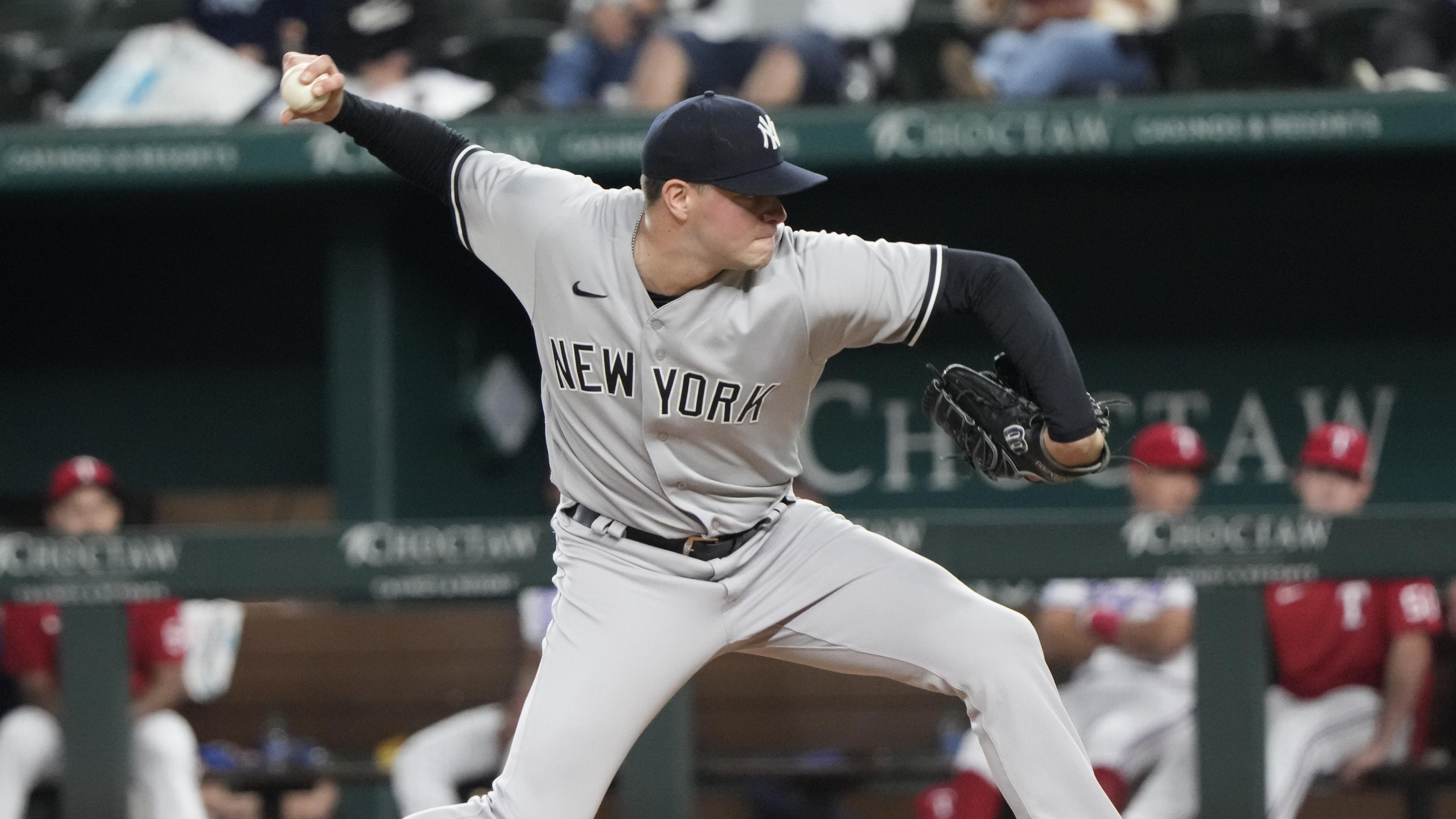 Oct 3, 2022; Arlington, Texas, USA; New York Yankees relief pitcher Scott Effross (59) delivers a pitch to the Texas Rangers during the ninth inning at Globe Life Field. The Yankees won 3-1. Mandatory Credit: Jim Cowsert-USA TODAY Sports