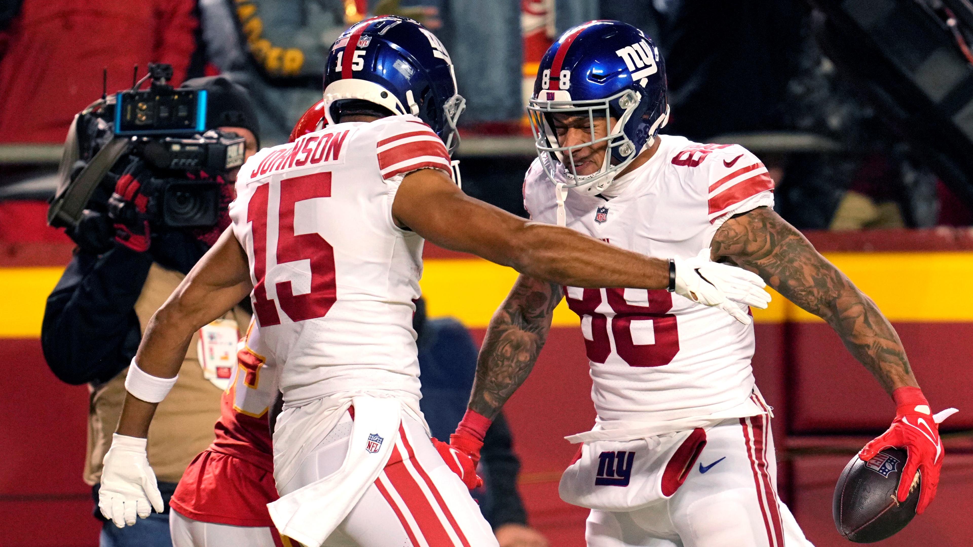 Nov 1, 2021; Kansas City, Missouri, USA; New York Giants tight end Evan Engram (88) celebrates with wide receiver Collin Johnson (15) after scoring a touchdown during the second half against the Kansas City Chiefs at GEHA Field at Arrowhead Stadium. Mandatory Credit: Jay Biggerstaff-USA TODAY Sports