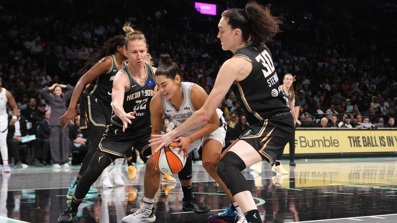 New York Liberty guard Courtney Vandersloot (22) and New York Liberty forward Breanna Stewart (30) defend against Las Vegas Aces guard Kelsey Plum (10) during game one of the 2024 WNBA Semi-finals at Barclays Center. / Gregory Fisher-Imagn Images