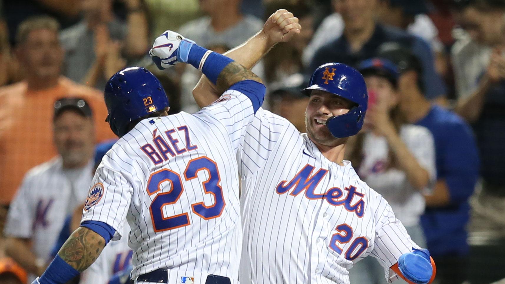 Jul 31, 2021; New York City, New York, USA; New York Mets shortstop Javier Baez (23) celebrates with first baseman Pete Alonso (20) after hitting a two-run home run against the Cincinnati Reds during the sixth inning at Citi Field.