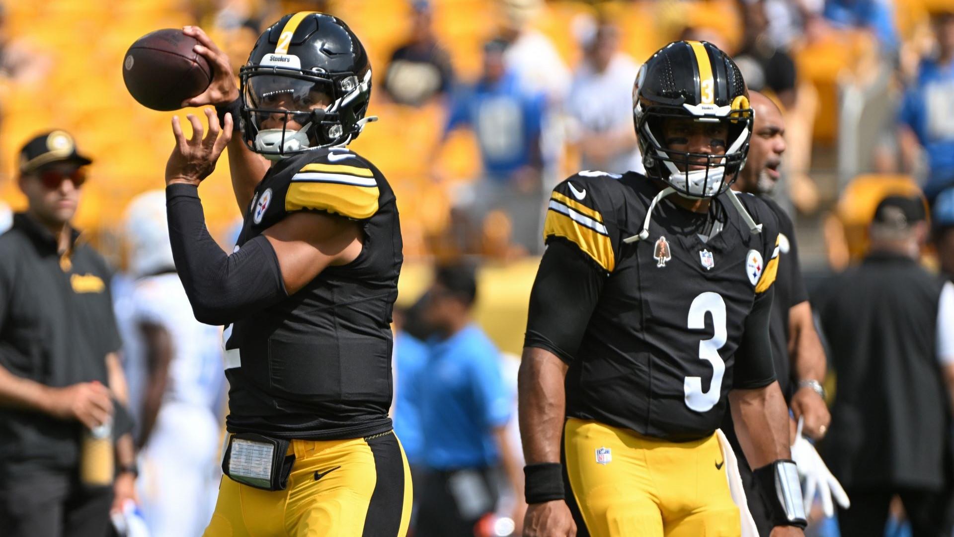 Sep 22, 2024; Pittsburgh, Pennsylvania, USA; Pittsburgh Steelers quarterback Justin Fields (2) warms up next to quarterback Russell Wilson (3) before a game against the Los Angeles Chargers at Acrisure Stadium. 