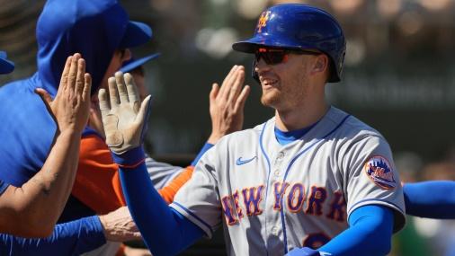 New York Mets center fielder Brandon Nimmo (9) is congratulated after scoring a run against the Oakland Athletics during the third inning at RingCentral Coliseum