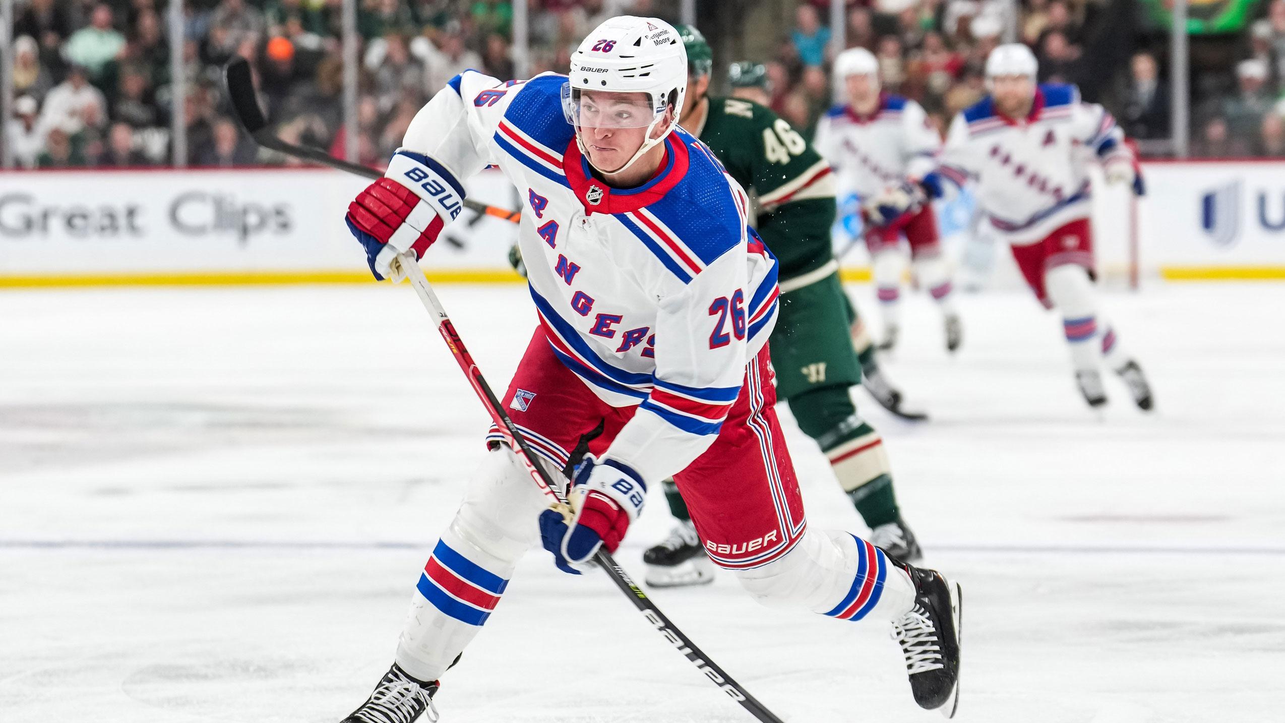 Oct 13, 2022; Saint Paul, Minnesota, USA; New York Rangers left wing Jimmy Vesey (26) shoots during the third period against the Minnesota Wild at Xcel Energy Center.