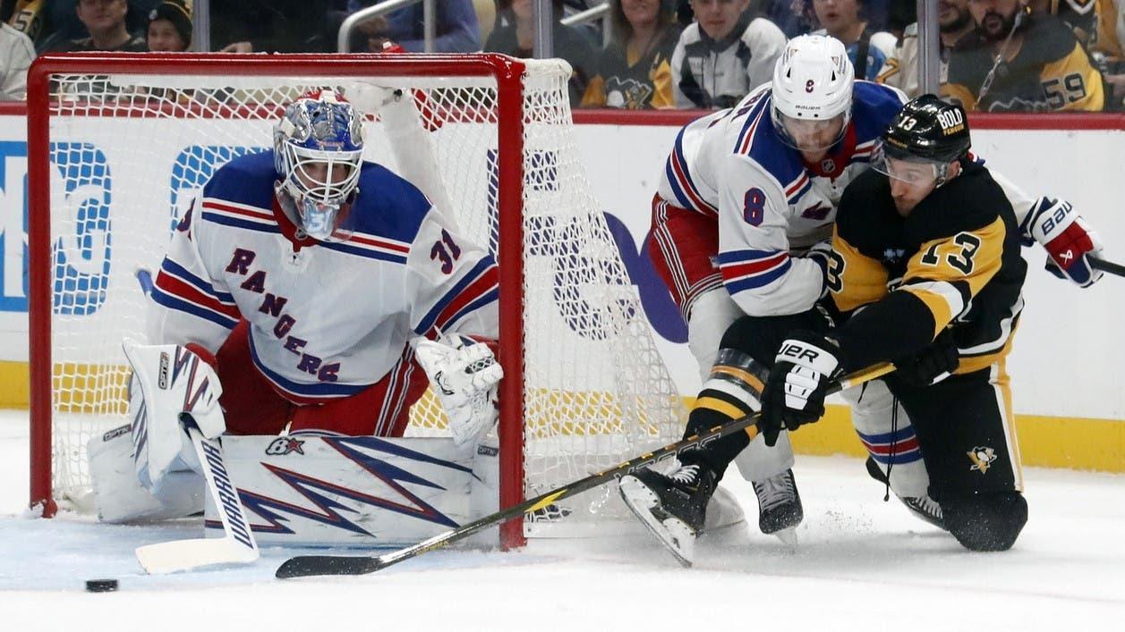 Oct 9, 2024; Pittsburgh, Pennsylvania, USA; New York Rangers goaltender Igor Shesterkin (31) and defenseman Jacob Trouba (8) defend the net against Pittsburgh Penguins right wing Kevin Hayes (13) during the first period at PPG Paints Arena. / Charles LeClaire-Imagn Images