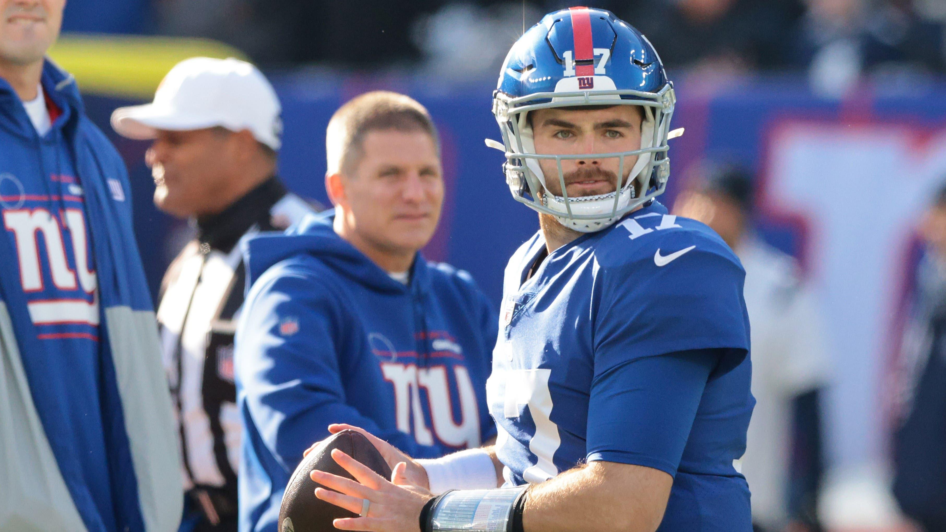 Dec 19, 2021; East Rutherford, New Jersey, USA; New York Giants quarterback Jake Fromm (17) throws the ball as quarterback Daniel Jones (8) looks on before the game against the Dallas Cowboys at MetLife Stadium. Mandatory Credit: Vincent Carchietta-USA TODAY Sports / Vincent Carchietta-USA TODAY Sports