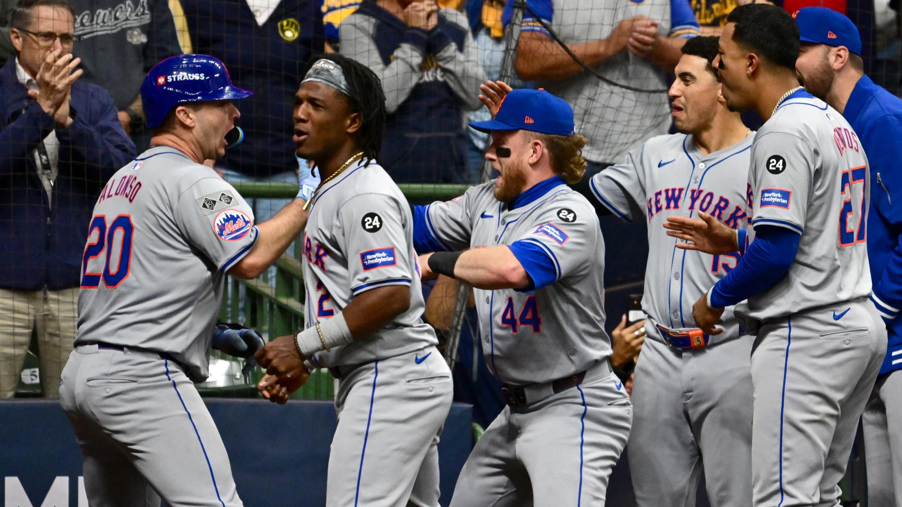 Oct 3, 2024; Milwaukee, Wisconsin, USA; New York Mets first baseman Pete Alonso (20) celebrates with teammates after hitting a three run home run against the Milwaukee Brewers in the ninth inning during game three of the Wildcard round for the 2024 MLB Playoffs at American Family Field. Mandatory Credit: Benny Sieu-Imagn Images