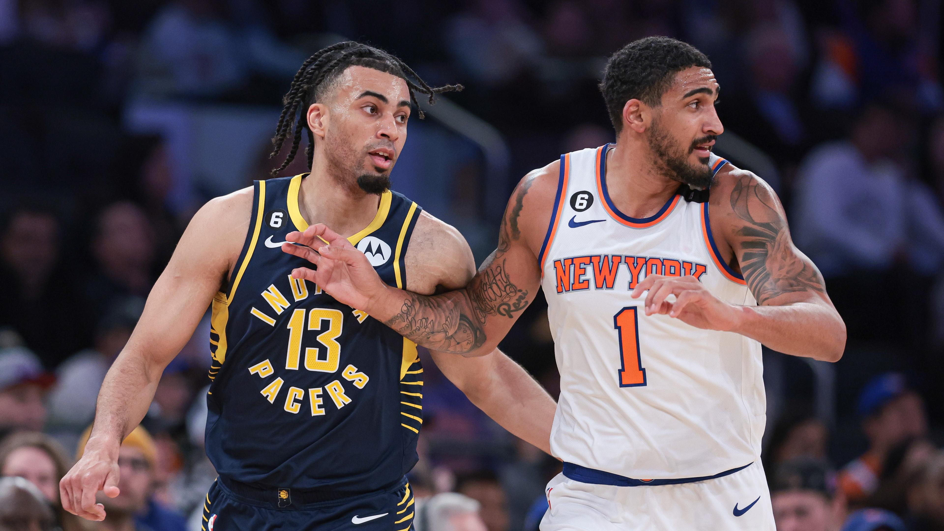 Apr 9, 2023; New York, New York, USA; Indiana Pacers forward Jordan Nwora (13) and New York Knicks forward Obi Toppin (1) run up court during the second half at Madison Square Garden. Mandatory Credit: Vincent Carchietta-USA TODAY Sports