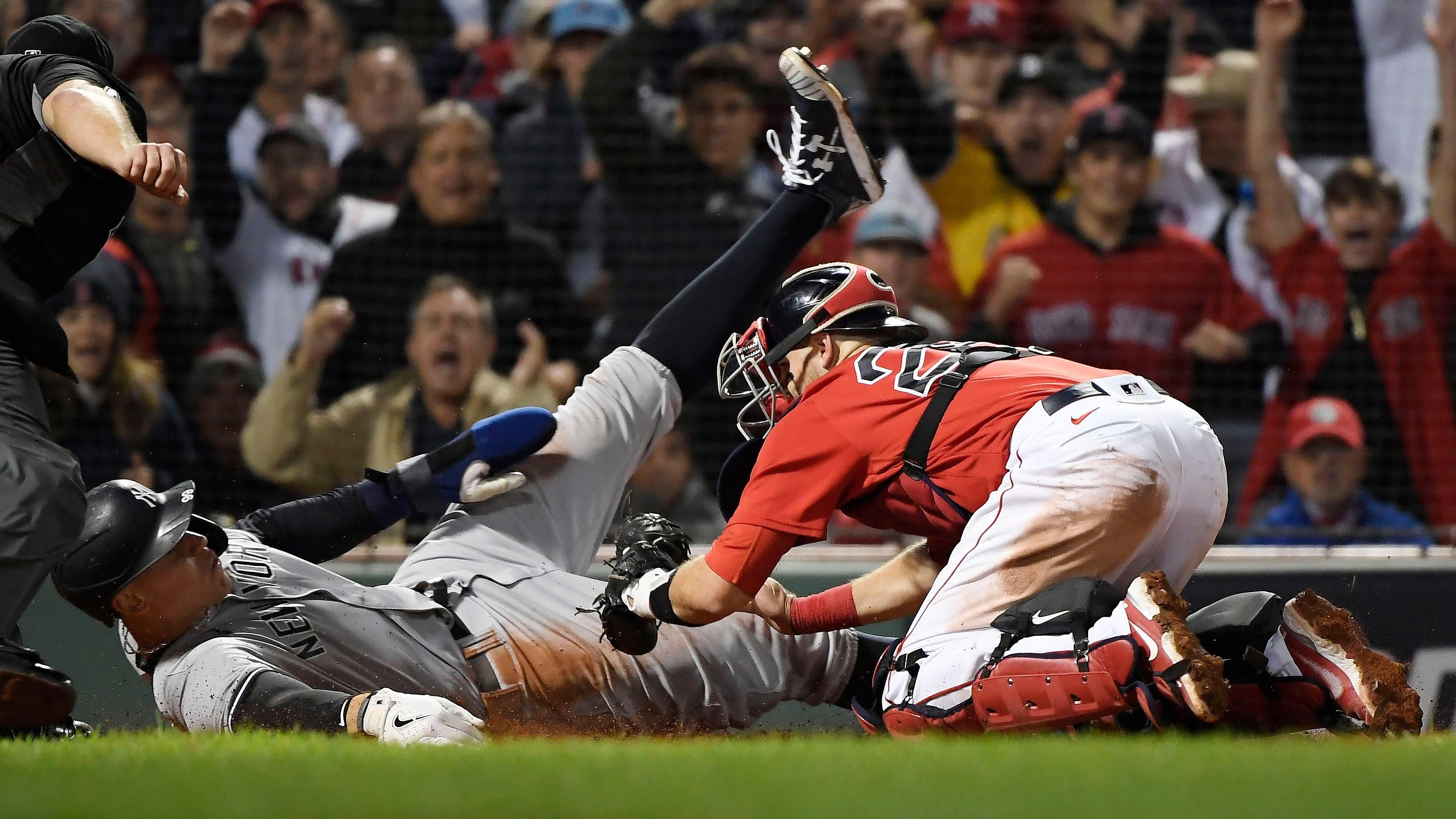 Oct 5, 2021; Boston, Massachusetts, USA; New York Yankees right fielder Aaron Judge (99) is out at home against Boston Red Sox catcher Kevin Plawecki (25) during the sixth inning of the American League Wildcard game at Fenway Park.