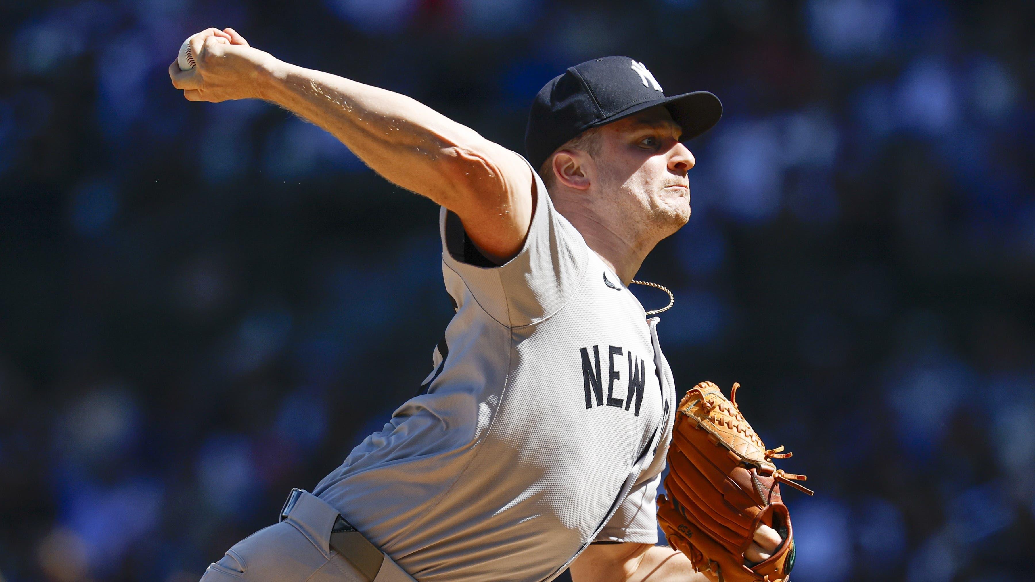 New York Yankees starting pitcher Clarke Schmidt (36) delivers a pitch against the Chicago Cubs during the first inning at Wrigley Field / Kamil Krzaczynski - Imagn Images