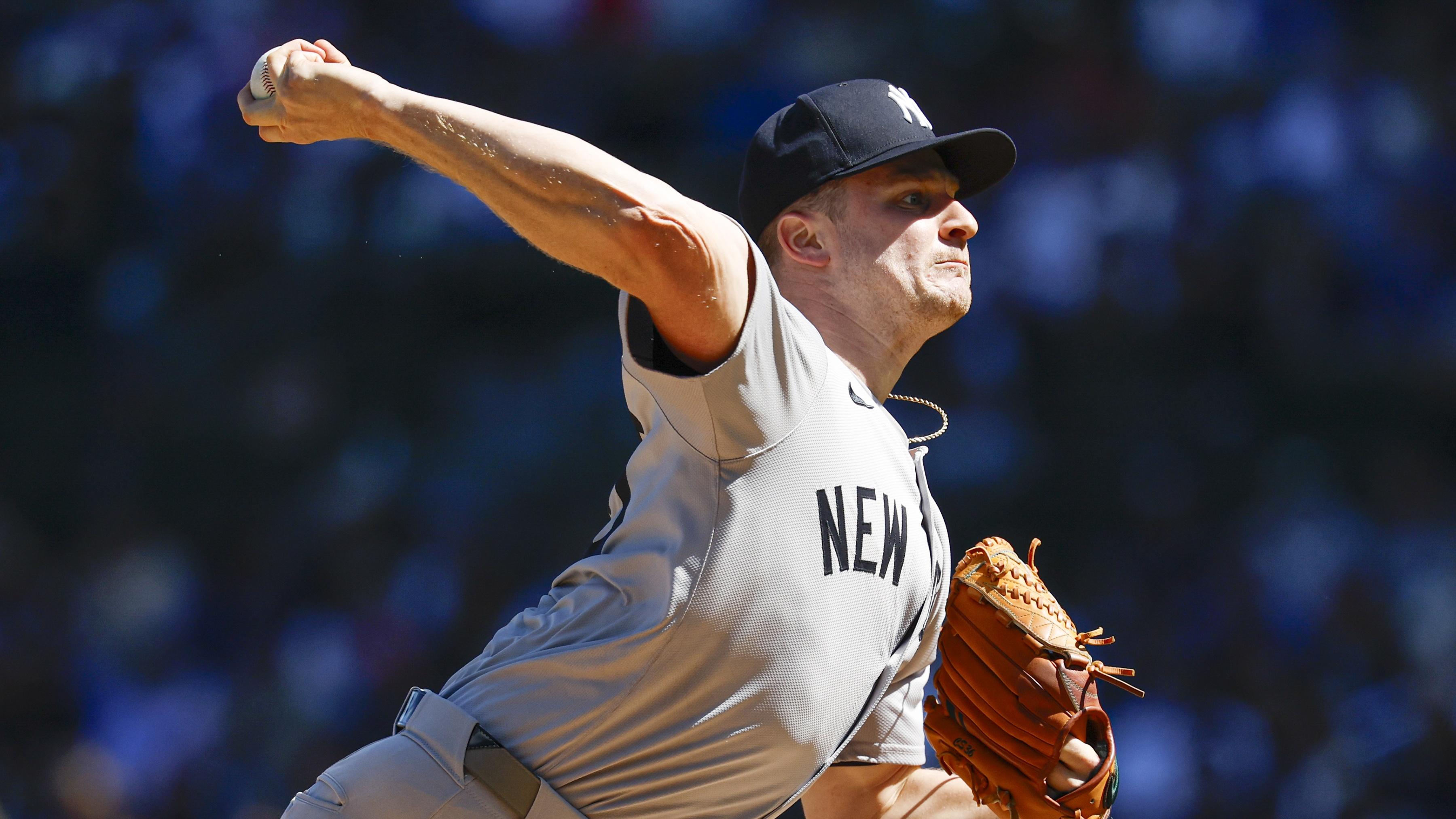 New York Yankees starting pitcher Clarke Schmidt (36) delivers a pitch against the Chicago Cubs during the first inning at Wrigley Field