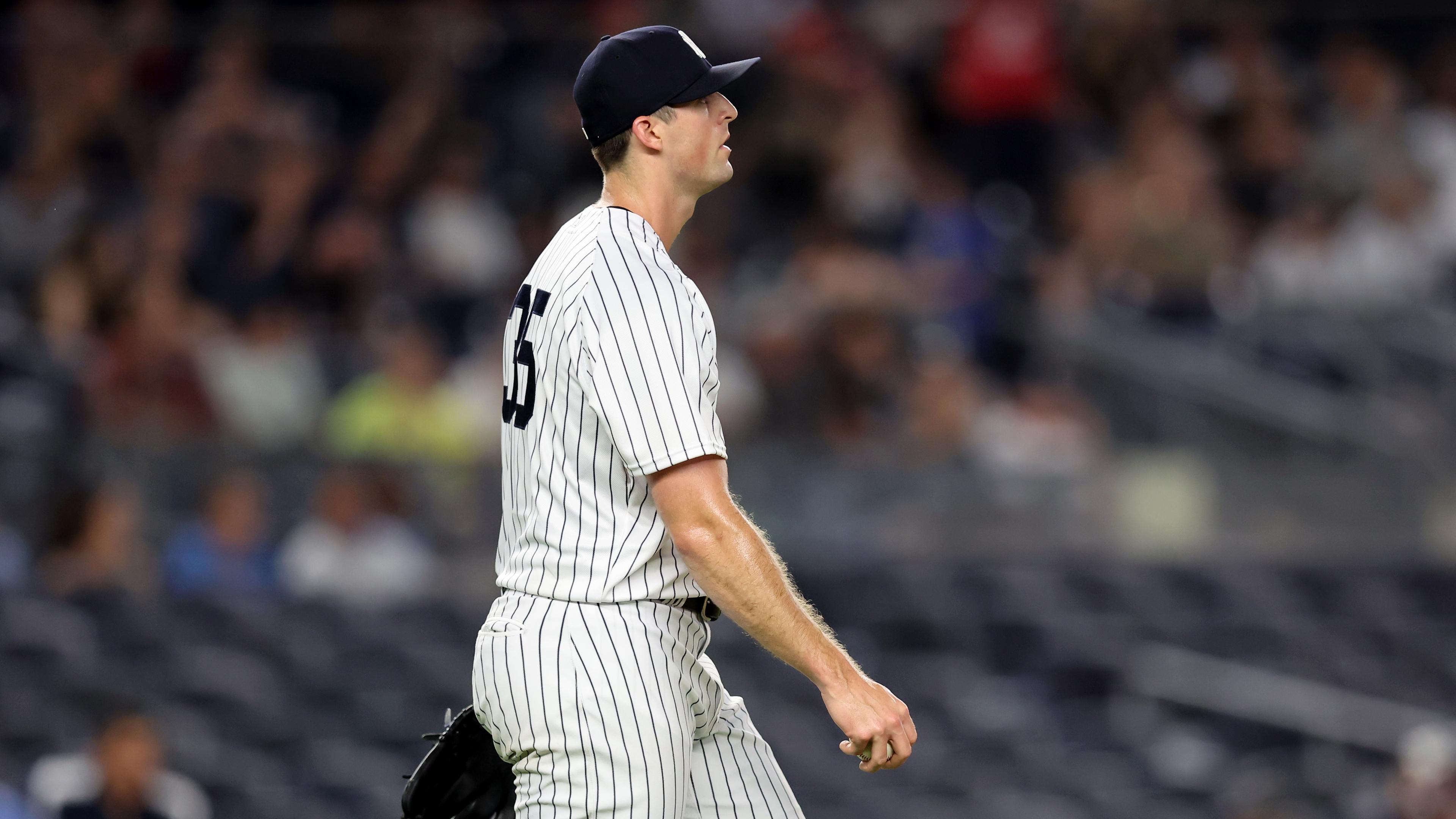 Jul 12, 2022; Bronx, New York, USA; New York Yankees relief pitcher Clay Holmes (35) reacts during the ninth inning against the Cincinnati Reds at Yankee Stadium. Mandatory Credit: Brad Penner-USA TODAY Sports