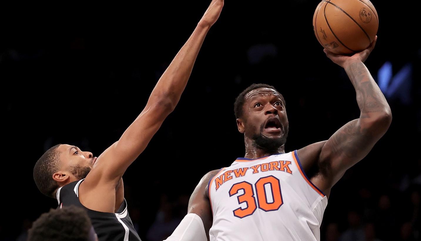 New York Knicks forward Julius Randle (30) drives to the basket against Brooklyn Nets forwards Mikal Bridges (1) and Royce O'Neale (00) during the first quarter at Barclays Center.