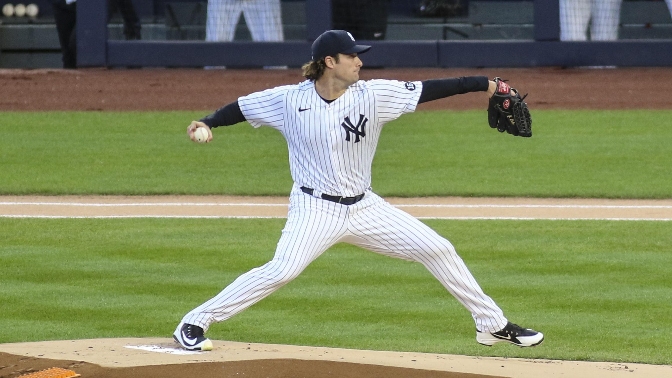 Apr 6, 2021; Bronx, New York, USA; New York Yankees pitcher Gerrit Cole (45) pitches in the first inning against the Baltimore Orioles at Yankee Stadium.