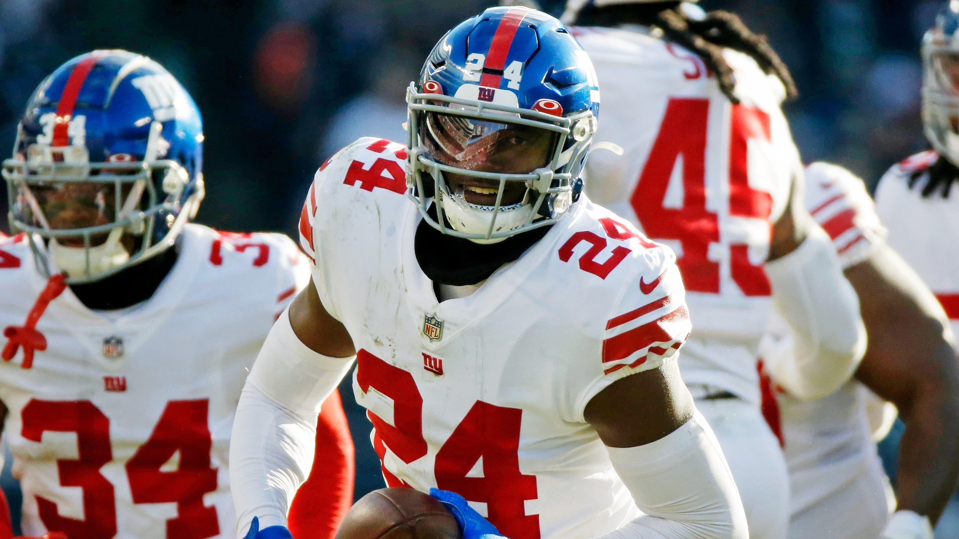 Jan 2, 2022; Chicago, Illinois, USA; New York Giants cornerback James Bradberry (24) reacts after intercepting a pass against the Chicago Bears during the second half at Soldier Field. Mandatory Credit: Jon Durr-USA TODAY Sports / © Jon Durr-USA TODAY Sports