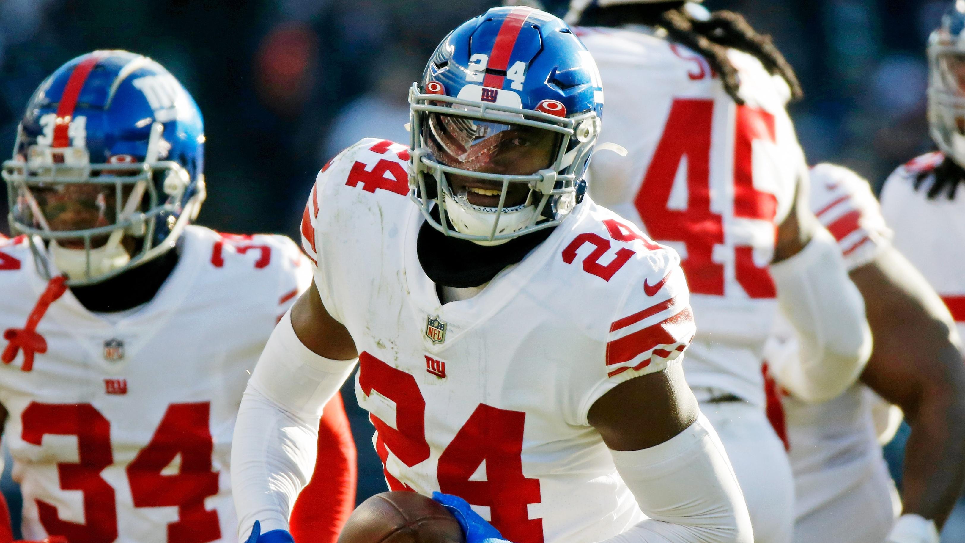 Jan 2, 2022; Chicago, Illinois, USA; New York Giants cornerback James Bradberry (24) reacts after intercepting a pass against the Chicago Bears during the second half at Soldier Field. Mandatory Credit: Jon Durr-USA TODAY Sports