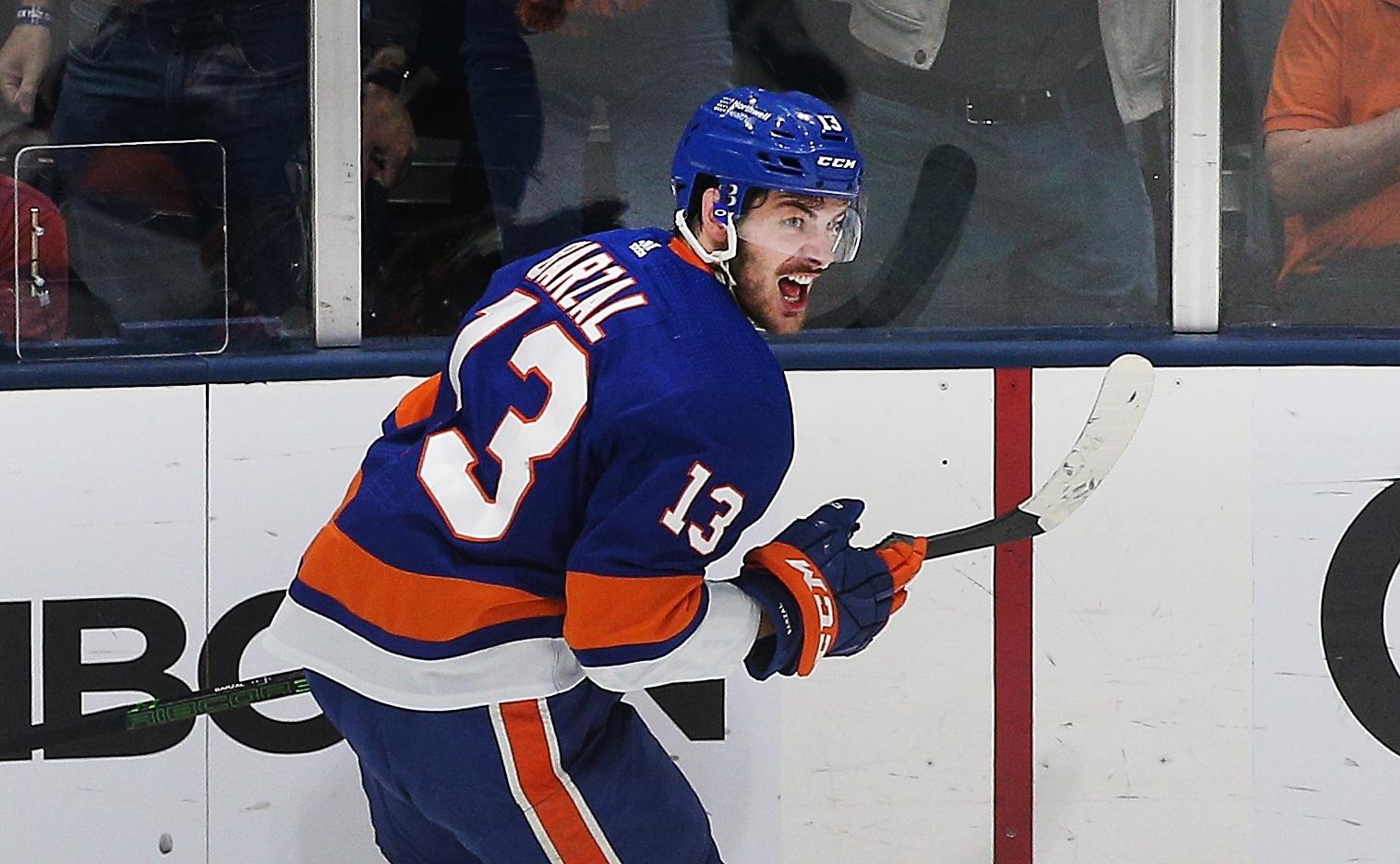 Jun 19, 2021; Uniondale, New York, USA; New York Islanders center Mathew Barzal (13) reacts after scoring a goal against the Tampa Bay Lightning during the second period of game four of the 2021 Stanley Cup Semifinals at Nassau Veterans Memorial Coliseum. Mandatory Credit: Andy Marlin-USA TODAY Sports